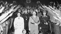 Getty Images Adolf Hitler and Minister of Propaganda Joseph Goebbels (left) receiving the Nazi salutes of their followers in the Berlin sports Palast in 1933.