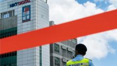 Police tape is seen outside the headquarters of the Apple Daily newspaper and its publisher Next Digital Ltd. on June 17, 2021 in Hong Kong, China