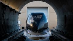 Virgin Hyperloop pod at mouth of tube
