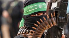 A member of Ezzedine al-Qassam Brigades, military wing of the Palestinian Hamas movement, takes part in a parade in Gaza City on 14 November 2021