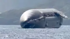 SpaceX rocket floating on the ocean