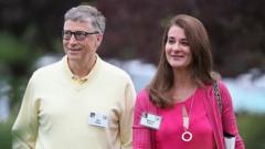 Bill and Melinda Gates walking through garden area at 2015 event