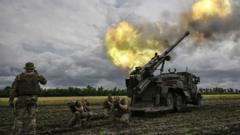 Ukrainian servicemen fire with a French self-propelled 155mm/52-calibre gun Caesar towards Russian positions at a front line in the eastern Ukrainian region of Donbas.