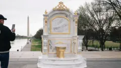 A new "Golden Throne" statue appeared early in the morning near the Lincoln Memorial.