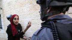 Palestinian woman argues with Israeli policeman