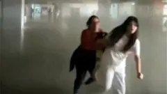 Women running as earthquake hits building