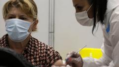 A woman gets a Covid-10 vaccine in Belgrade, Serbia. File photo