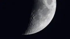 The Moon in part shadow, with craters showing