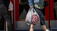 A person walking out of Target with a bag
