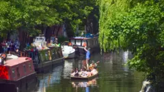 Getty Images People on a boat on the Regent's Canal