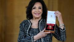 Shirley Bassey receives top honour from the King