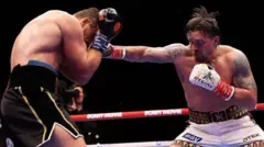 Oleksandr Usyk lands a punch on Rico Verhoeven