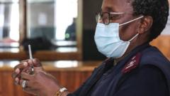 A healthcare worker in South Africa prepares a dose of the Pfizer vaccine