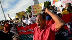 Sri Lankan activists take part in a demonstration outside the US embassy in Colombo on April 7, 2022, denouncing the government of President Gotabaya Rajapaksa