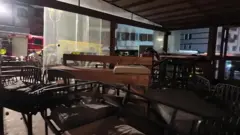 The Police Cantonel Valaissan image shows the terrace of Le Constellation bar. Chairs, benches and their mattresses can be seen scattered all over the room.