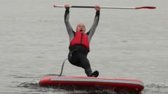 Going, going, gone: Ed Davey takes a dip in Windermere