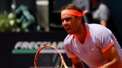 Nadal fights back to reach second round in Rome