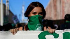A demonstrator wears a green handkerchief at a demonstration in favour of decriminalising abortion on the International Safe Abortion Day, 28 September 2020 in Queretaro, Mexico