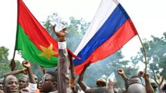 Burkina Faso pipo dey fly Russia and dia kontri flags