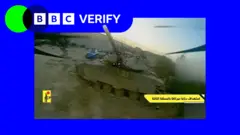A screenshot from a video feed of an FPV drone, it is approaching a tank 