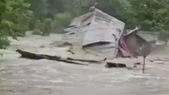 Flash flood tears down a mill.