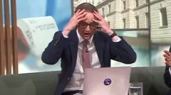 Chris Mason with his hands on his head