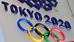 The logo for the Tokyo 2020 Olympic Games is seen in Tokyo on March 15, 2020.