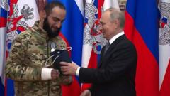 Vladimir Putin presents a state award to Wagner PMC fighter Aikom Gasparyan