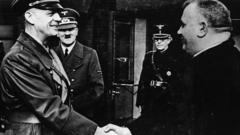 German Foreign Minister Joachim Von Ribbentrop greeting Jozef Tiso (R) as Adolf Hitler looks on