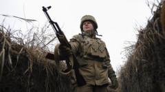 A Ukrainian serviceman checks the situation at the positions on a front line near Zolote village, not far from where pro-Russian militants controlled city of Luhansk, Ukraine, 09 February 2022
