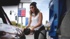 woman filling car with petrol