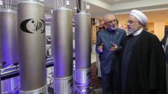 Iranian President Hassan Rouhani (R) and the head of Iran nuclear technology organization Ali Akbar Salehi inspecting nuclear technology on the occasion of Iran National Nuclear Technology Day in Tehran, Iran, 9 April 2019