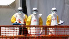 Health workers dressed in protective suits at an Ebola treatment centre in DR Congo