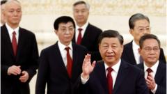 New Politburo Standing Committee members Xi Jinping, Li Qiang, Zhao Leji, Wang Huning, Cai Qi, Ding Xuexiang and Li Xi arrive to meet the media following the 20th National Congress of the Communist Party of China, at the Great Hall of the People in Beijing, China October 23, 2022