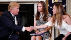 US President Donald Trump shakes hands with Marjory Stoneman Douglas High School student Ariana Klein