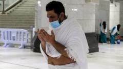 One Muslim pilgrim dey prays for di Grand Mosque for di holy city of Mecca, Saudi Arabia