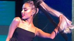 Ariana Grande holding her pony tail