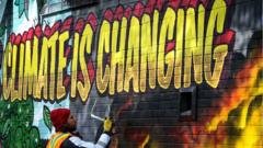mural that reads 'climate is changing'
