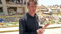 The BBC's Will Grant reports from the site of a collapsed building in La Guaira, Venezuela