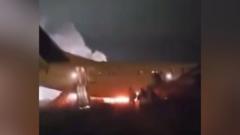 Passengers flee burning plane that skidded off runway