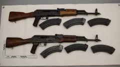 Greater Manchester Police two rifles with magazines on white background.