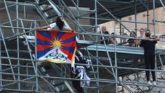 A protester holds a Tibetan flag during a demonstration at the Acropolis Propylaea, in Athens, Greece, October 17, 2021.