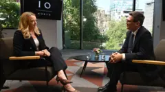 Laura Kuenssberg and Andy Burnham sat opposite each other talking