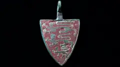 Tony Jolliffe BBC Gold 'three lions' pendant from the 13th-14th century. The heraldic device or harness pendant survives in incredible condition.