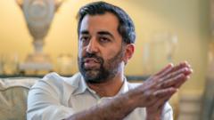 Humza Yousaf: Who is Scotland's under-threat first minister?