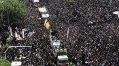 Iran's supreme leader leads prayers at Raisi funeral