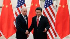 Joe Biden and Xi Jinping shake hands