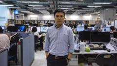 Apple Daily editor-in-chief Ryan Law posing for a portrait in the newsroom in Hong Kong