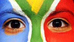 A South African girl with the national colors painted on her face poses at Mandela Square in Johannesburg on June 19, 2010 during the 2010 Football World Cup in South Africa.