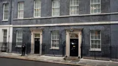 exterior view of 10 Downing street with a police officer